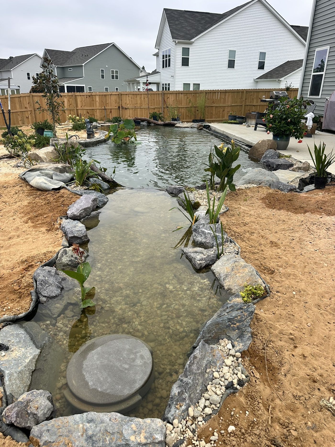 Constructed gravel wetland bog filter with Snorkel vault