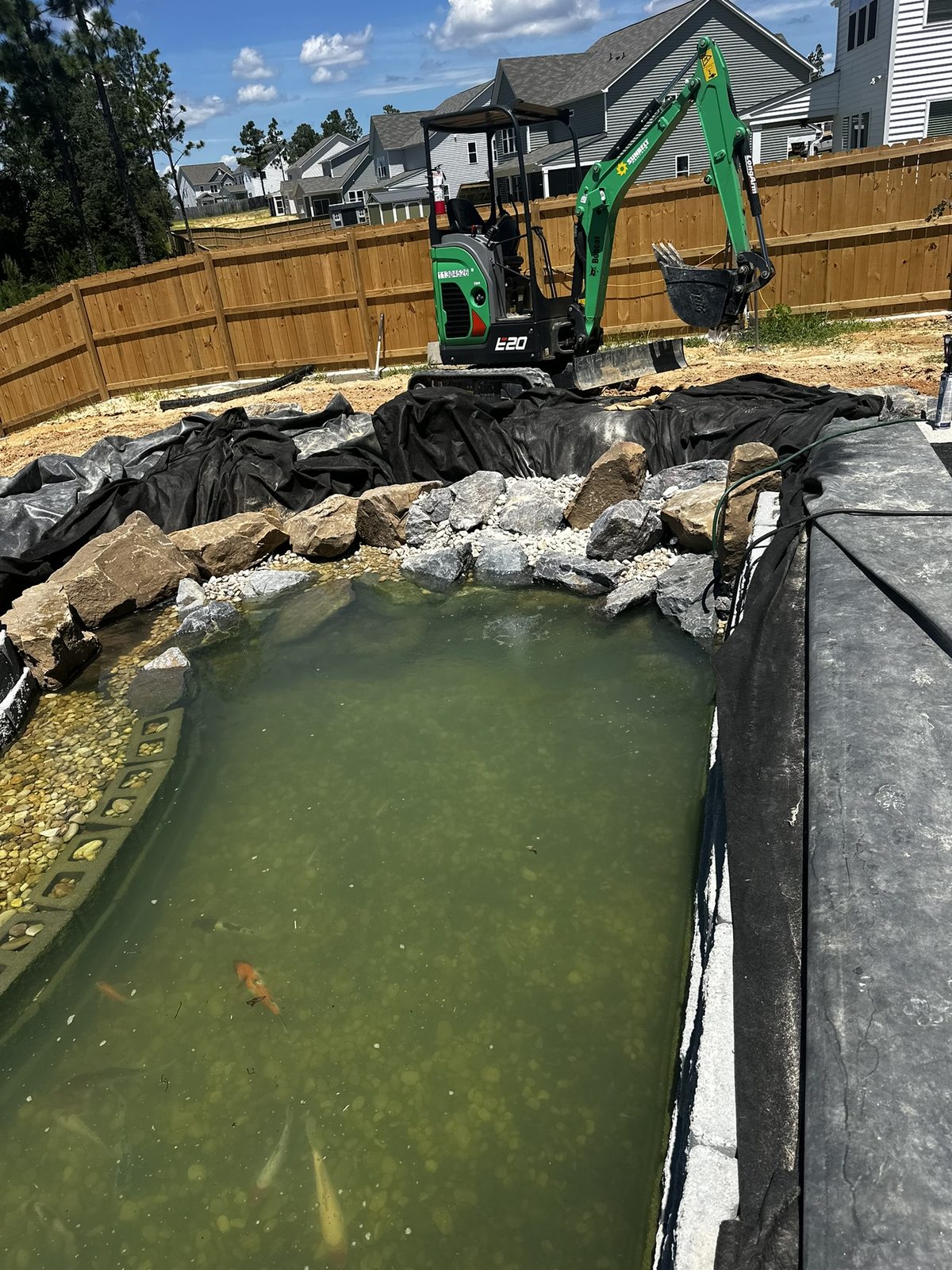 Setting boulders by hand and machine